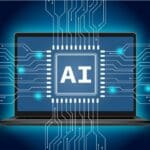Laptop displaying a central AI chip with glowing circuits radiating outward, symbolizing artificial intelligence in computing.